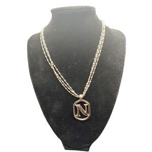 Three chain silver tone necklace with monogram “N” heart clasps